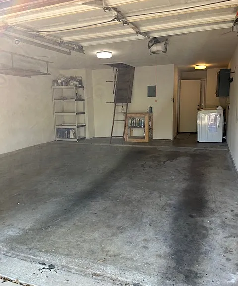 large two car garage with access to the attic.