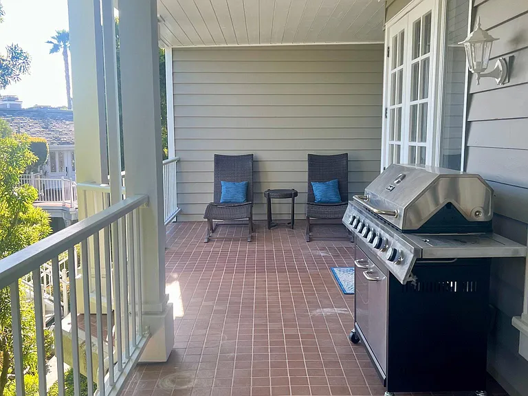 Very large balcony with lots of natural light, garden views, patio furniture and high BTU natural gas BBQ