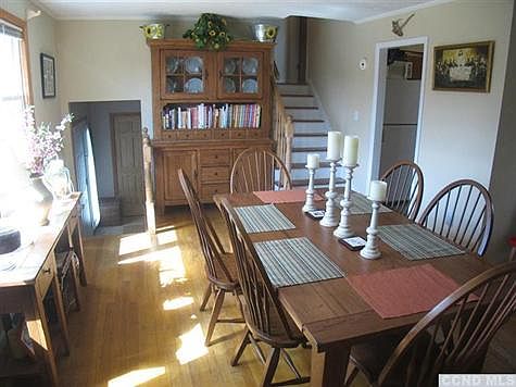 The former living room is now used as a big, family, dining room.