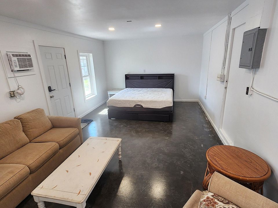 Large main room with stained concrete floors. Window ac. Very priv