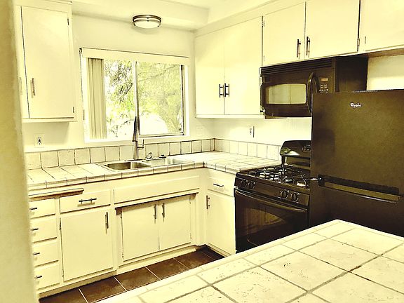 Great Kitchen, with imported Italian tiles & premium appliances, coved raised ceiling detail.
