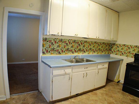 Kitchen with stove range included.