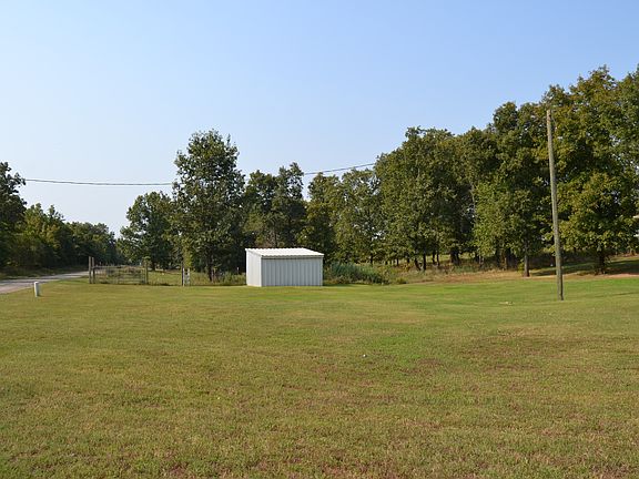 Partially fenced wih shed