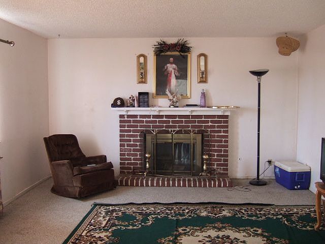 Living room w/brick fireplace