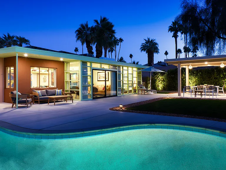 The backyard lit up at night.