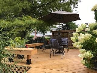 Retreat to the backyard for relaxing and entertaining on a large custom designed cedar deck.