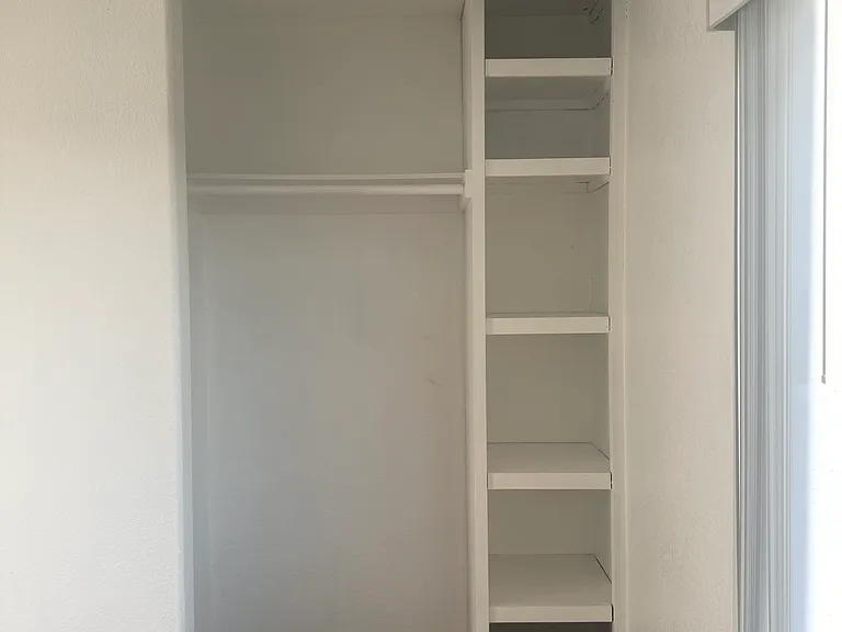 Closet in secondary bedroom