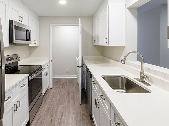 Select units feature upgraded kitchens and in unit laundry