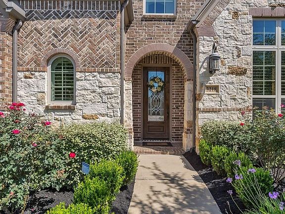 The stone elevation and classic lines give this home gorgeous curb appeal!