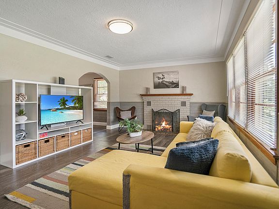 Spacious living room with plenty out natural light.