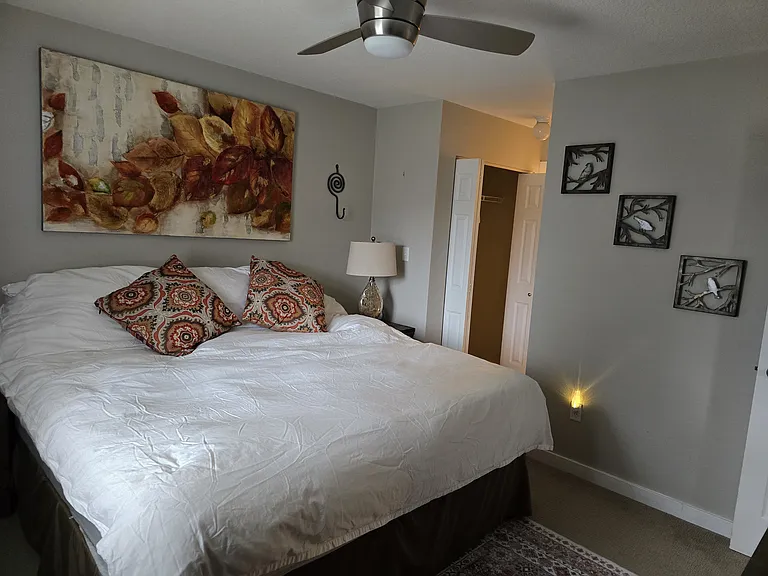 Master bedroom with adjacent closets, bath, and toilet. Opens to great room.