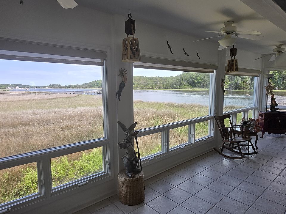 living room wall of glass. downstairs rec room has same views