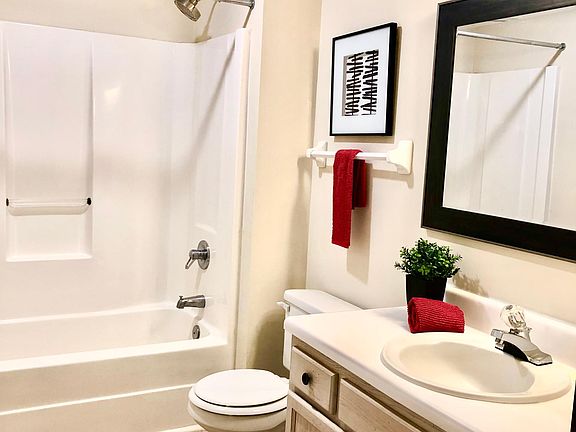 Large master bath with new light fixtures and mirrors