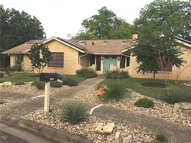 Beautifully xeriscaped 4/3 brick ranch-style home in Anderson Mill near all exemplary RRISD schools.