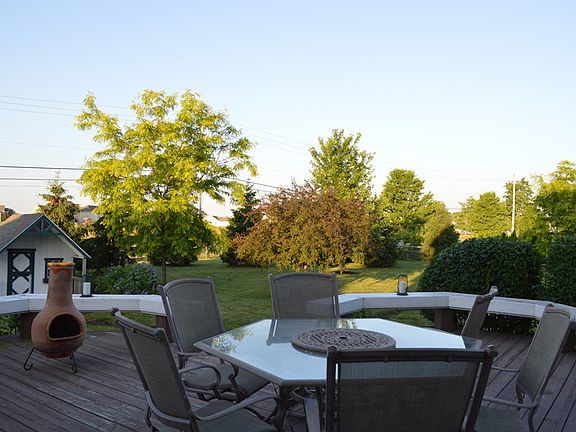 Huge deck and backyard.
						:
						Large 2 tier deck, playhouse & beautiful backyard with mature trees for privacy