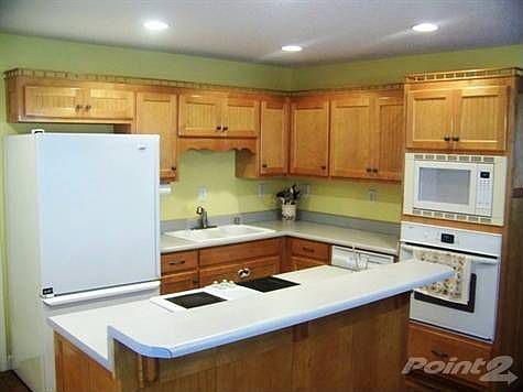 Kitchen with lots of Maple Cabinets
