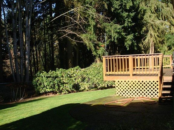 Nice deck and patio with 2 gas bbq hookups; fenced backyard is open to wooded area with trail that leads to neighborhood park & pool.