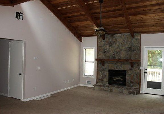 Living Room with Stone Fireplace