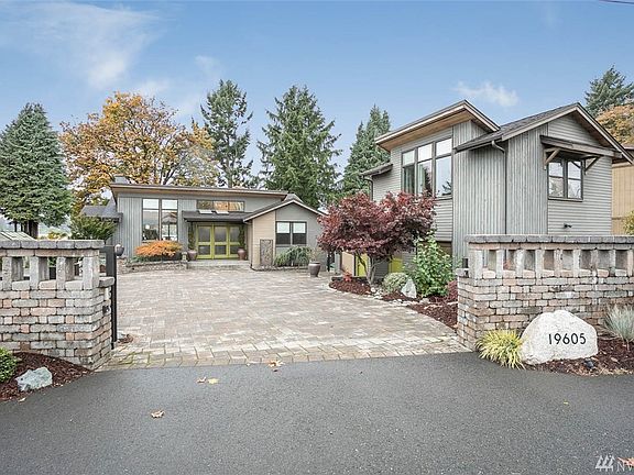 Gated Entry leads into the driveway area that is big enough for many cars, a boat, or an RV.
