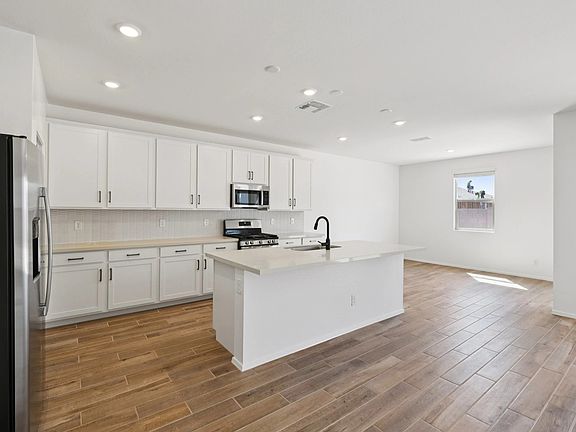 Great room space with kitchen and dining nook