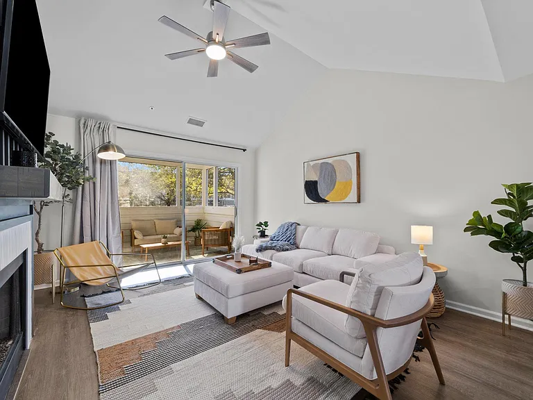 Comfortable sectional sofa, smart TV and fireplace.