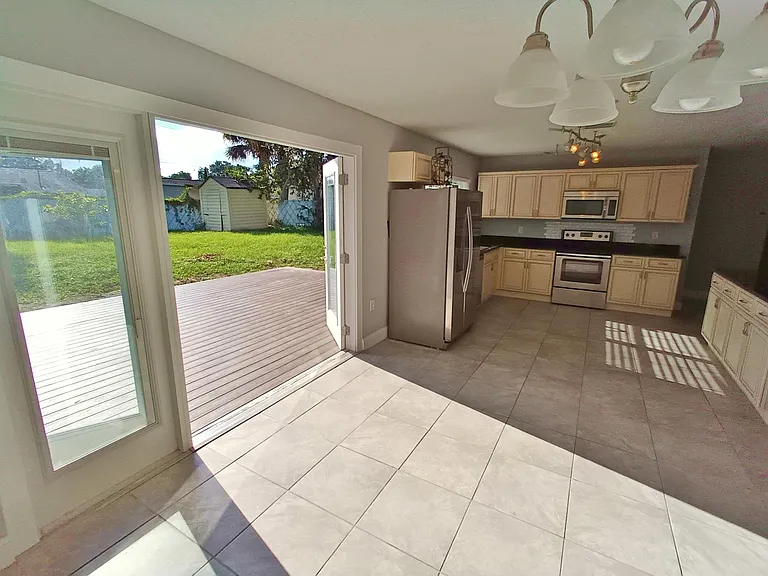 Kitchen and dining area (wide angle view with French doors open)