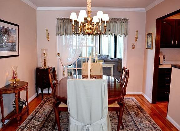 Dining room has sliders to the sunroom addition