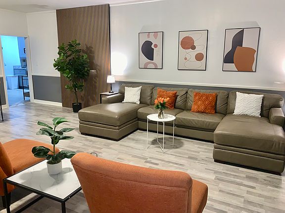 Comfortable leather sofa that doubles as a full-size pull-out bed_perfect for relaxing during the day and accommodating extra guests at night.