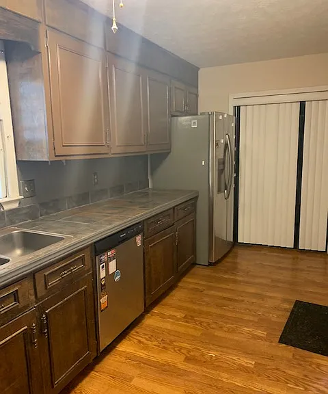 Kitchen laundry room at the end.
