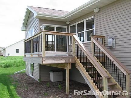 Maintenance-free deck off kitchen
						:
						Patio doors in kitchen open to maintenance-free deck; stairs lead to brick patio