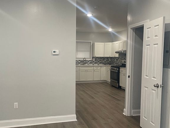 Kitchen view from living room. Closet to the right