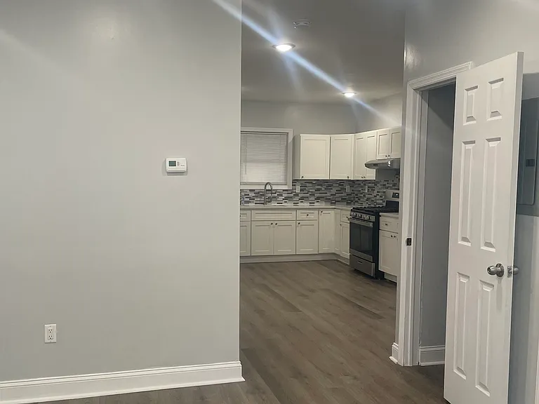 Kitchen view from living room. Closet to the right