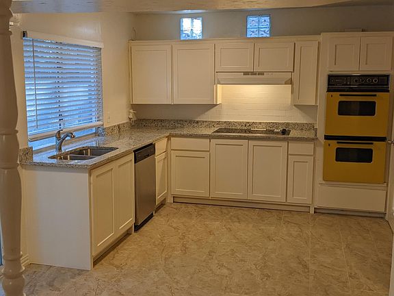 Remodeled Kitchen- Granite countertops, New cabinets, New porcelain floor tile, New sink, and faucet.