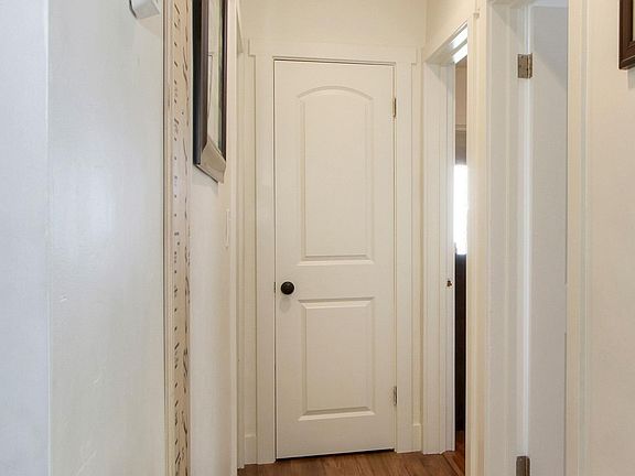 hallway that leads to front bathroom and 2 bedrooms