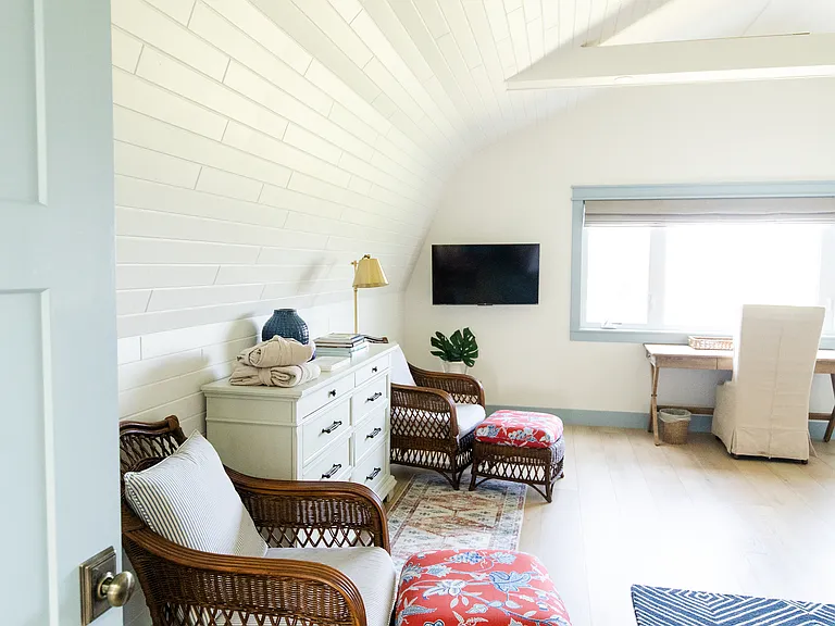 The master room includes a king size bed, built-in closet space, a dresser, a desk, and a smart TV
