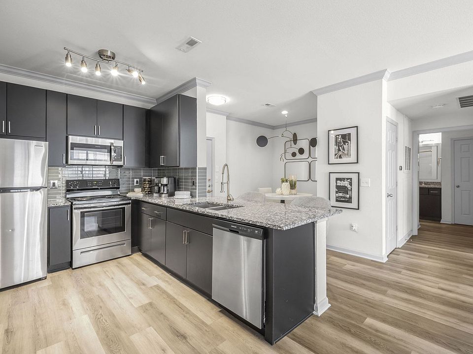 Two Bedroom - kitchen with stainless steel appliances and granite countertops