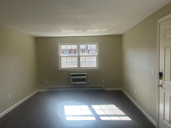 Living room has through the wall AC, new windows throughout, laminate flooring throughout,