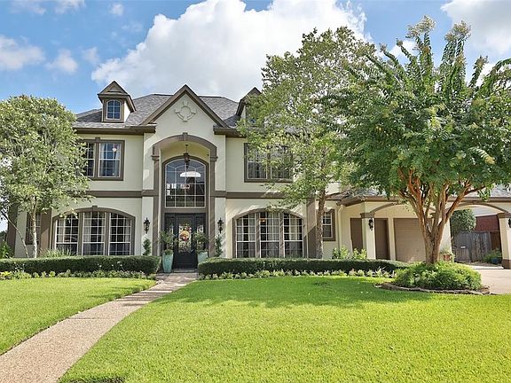 Lovely home with outstanding curb appeal, landscaping and new custom exterior paint.