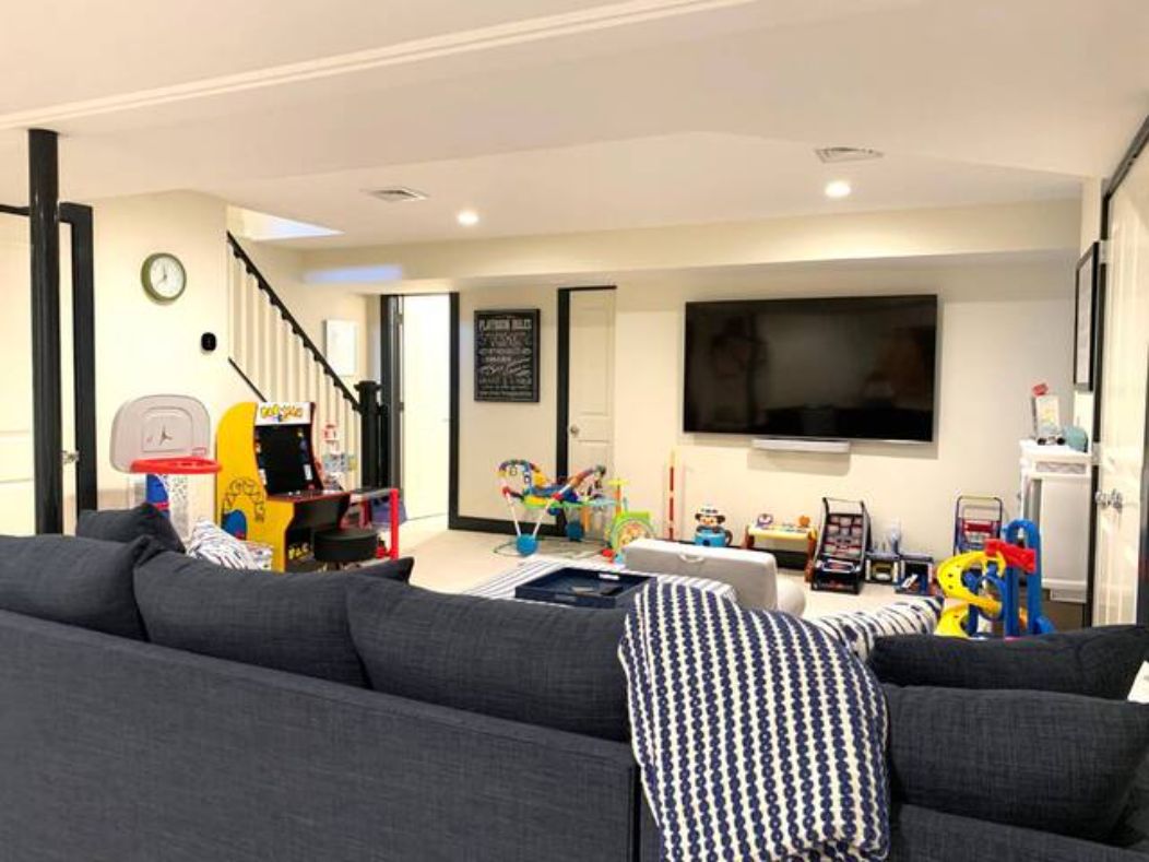  Lower Level - Media & Playroom_ Couch opens to queen sized bed