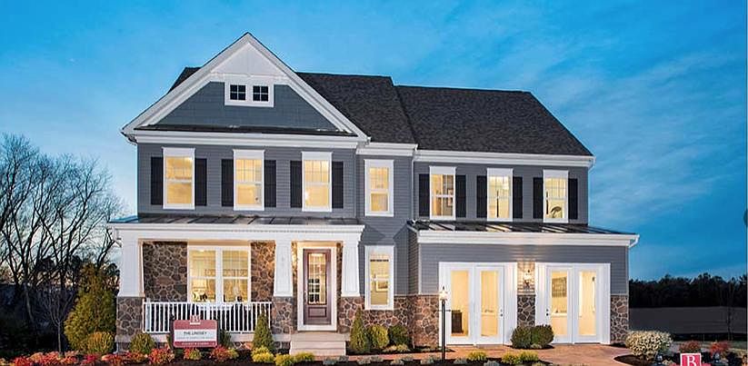Former model home, the Stanley Martin office has been converted to a 2-bay garage.