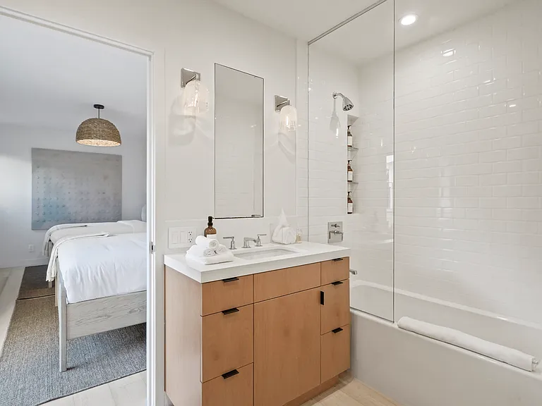 Modern design, premium bath essentials, and warm accents.