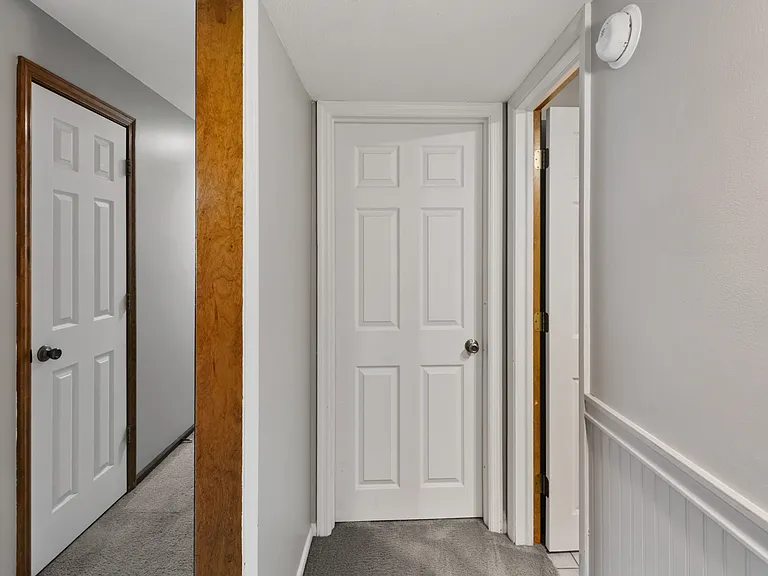 Basement hallway looking at mechanical room/laundry room