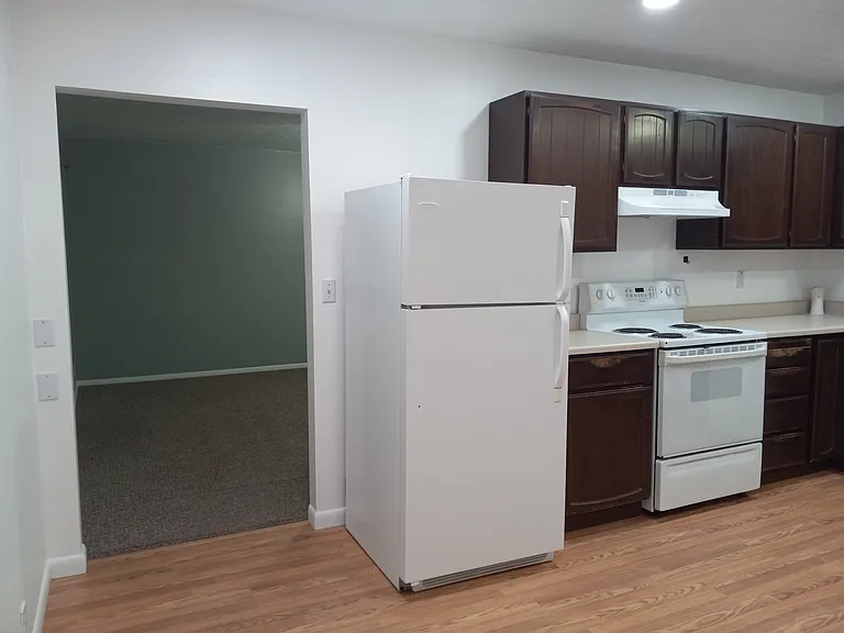 View of walkway between great room & kitchen/ dining area from the dining area
