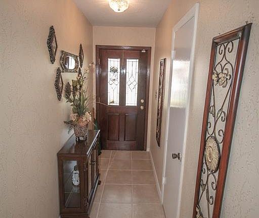 We open front door looking at the foyer