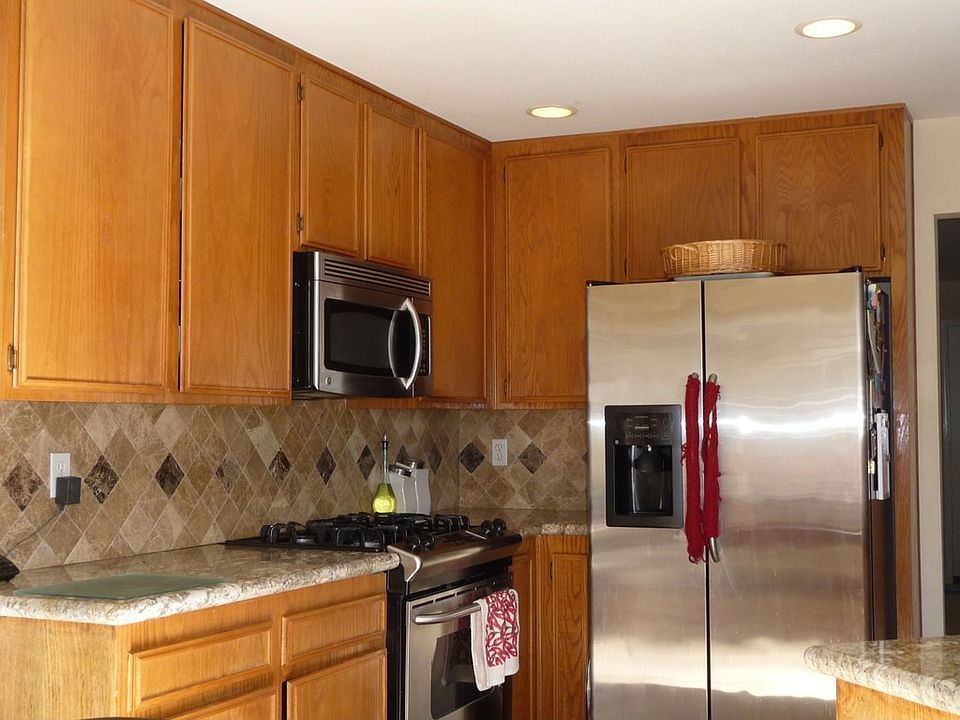 Kitchen with granite countertops and marble backsplash