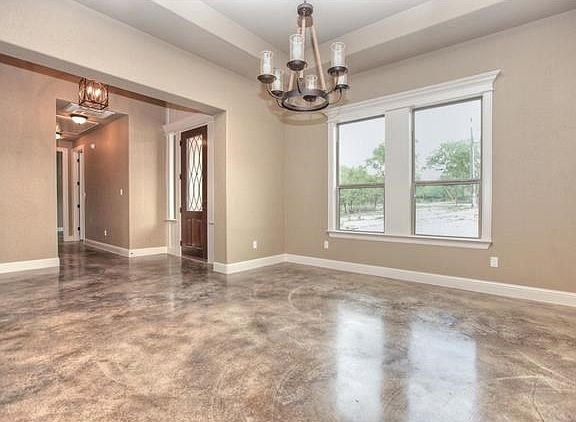 Formal Dining boasts high baseboards, custom wood-encased windows, coffered ceilings and upgraded fixtures.