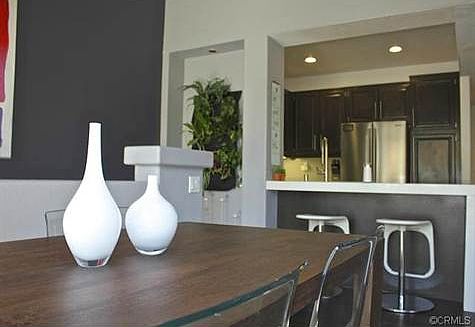 The open living space encompasses the dining room, living room a