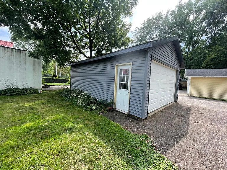 Side door to detached garage.