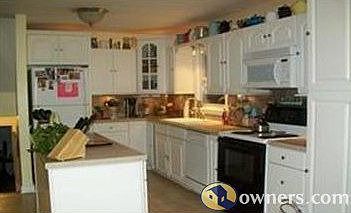 Upgraded Kitchen with island and tile floors