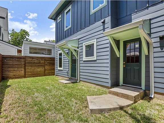 Left door leads to kitchen/living/dining area while right door leads to the garage.